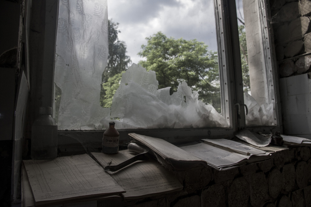 window and various items in abandoned room in Chernobyl