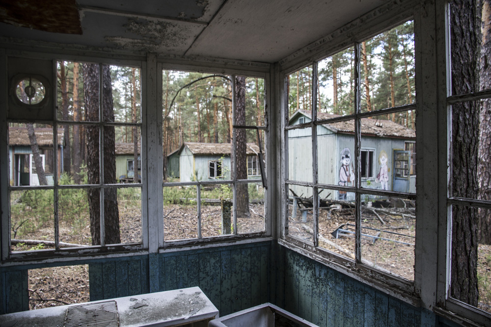 view from an abandoned cabin in the Chernobyl summer camp