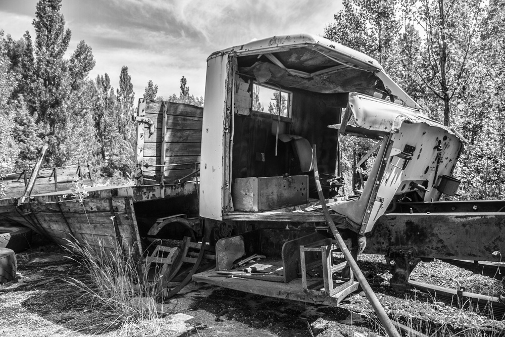 abandoned, rusting shell of a truck in Chernobyl