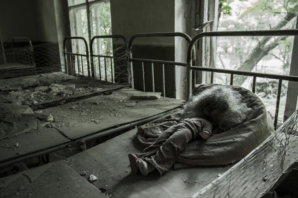 a doll in an abandoned nursery in Chernobyl