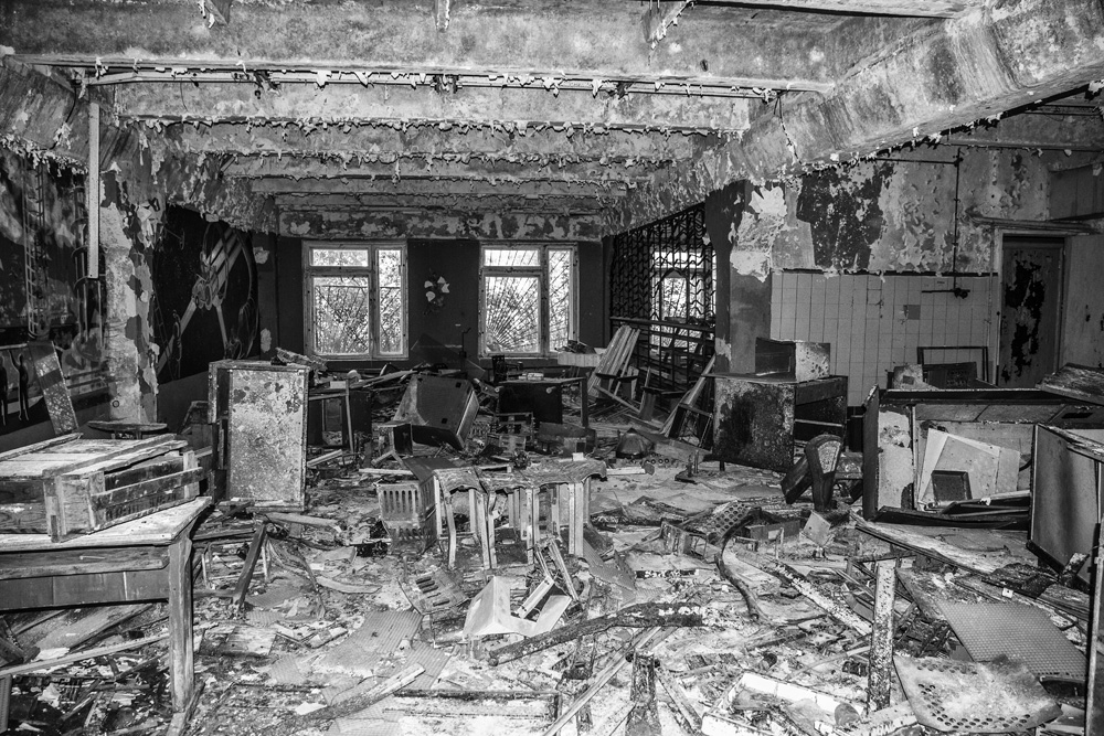 a chaotic, destroyed room in Chernobyl