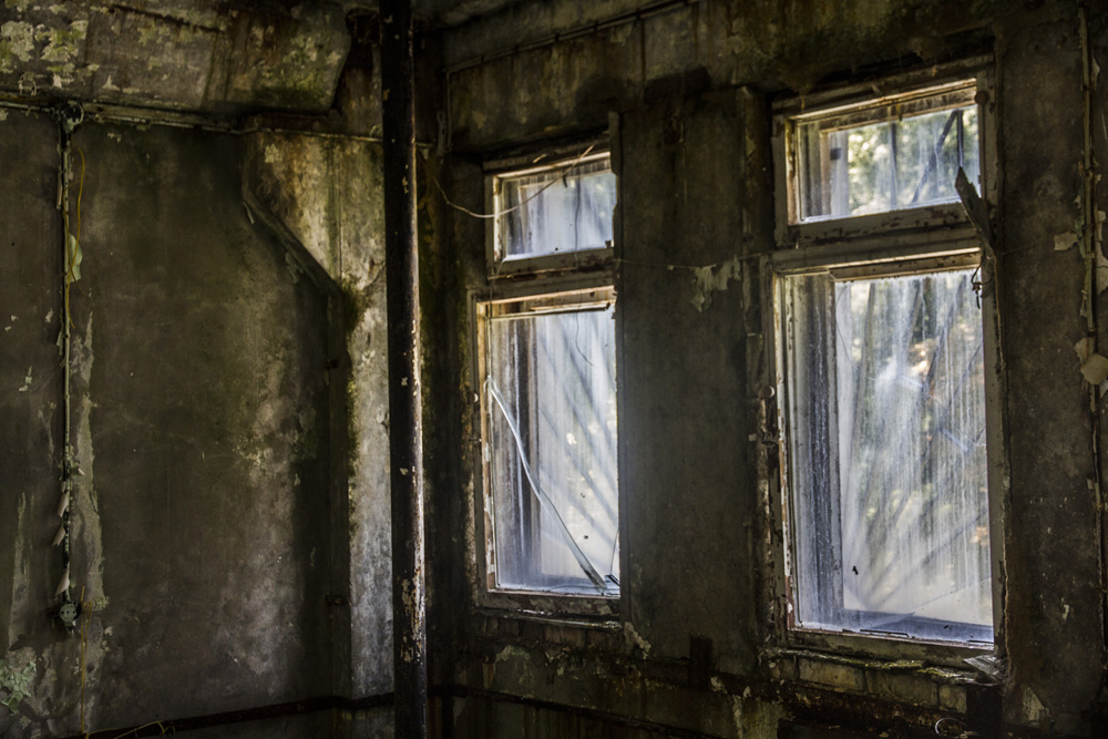 window in an old, abandoned building in Chernobyl