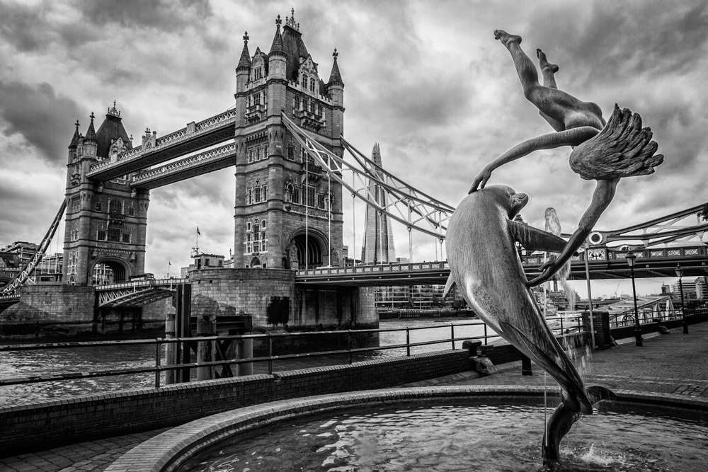 Tower Bridge and the Girl With Dolphin statue, London